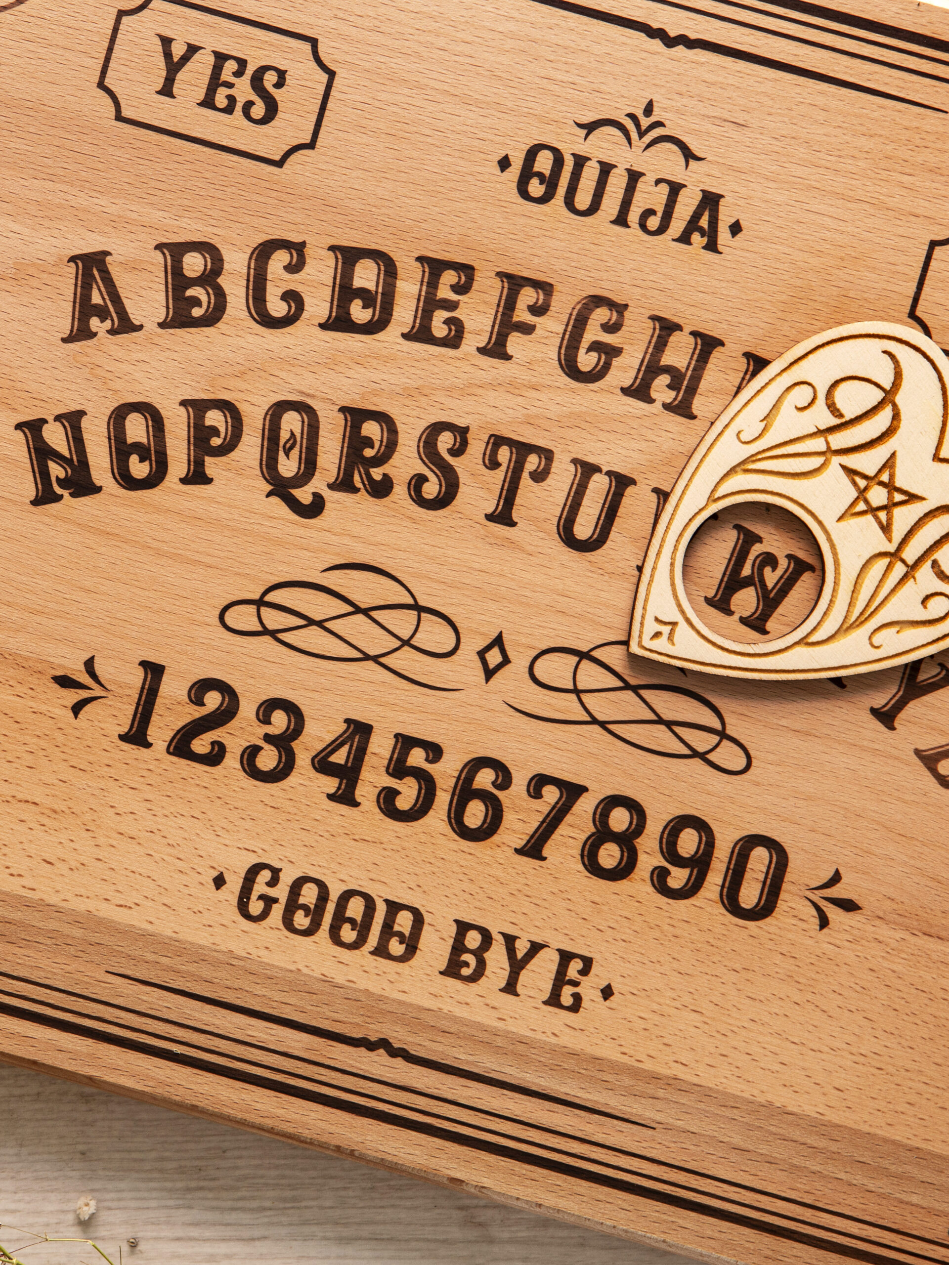 flat lay ouija board wooden table